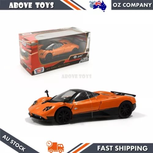 1:24 scale orange diecast sports car model in box, with black wheels and decals