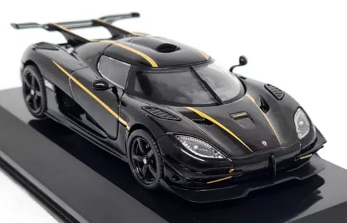 Black supercar diecast model with gold racing stripes and detailed headlights