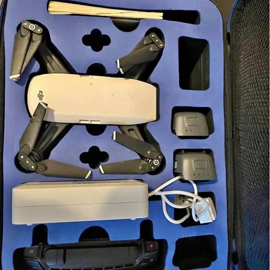 DJI Spark drone kit with folded quadcopter and controller