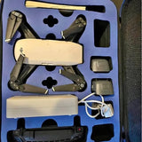 DJI Spark drone kit with folded quadcopter and controller