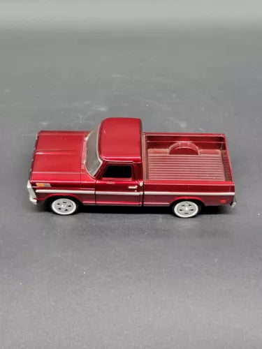 Red 1969 Ford F-150 pickup diecast model, side view