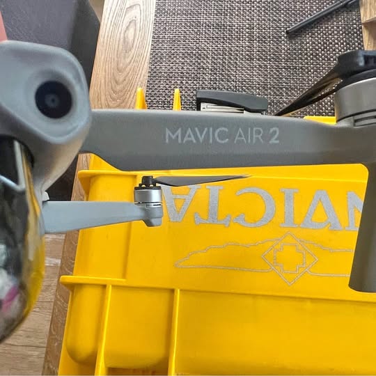 Gray DJI Mavic Air 2 drone body with prop arms visible