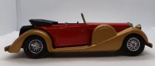 Red and tan diecast coupe model with black wheels, open cabin