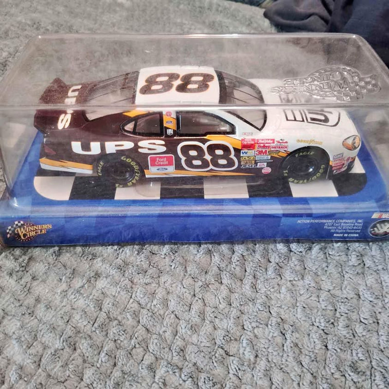 NASCAR diecast collectible car with UPS livery, number 88, in clear display box