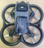 DJI Avata drone with four propellers, dark gray body and forward camera module