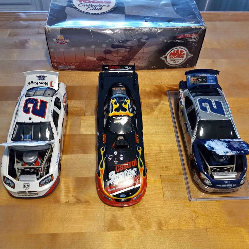 Diecast collectible race cars set: white car with red number, black flame graphics, blue car