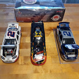 Diecast collectible race cars set: white car with red number, black flame graphics, blue car