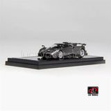 1:64 scale metallic grey diecast model car on black display base