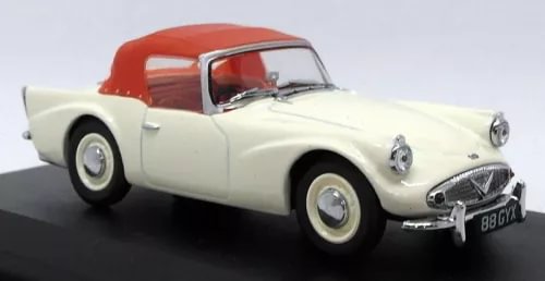 Ivory and red diecast model car, front three-quarter view with chrome grille and headlights