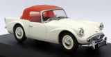 Ivory and red diecast model car, front three-quarter view with chrome grille and headlights