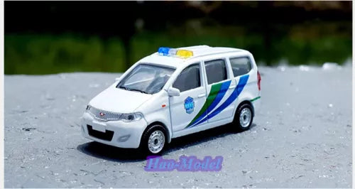 White diecast car model with blue and green racing stripes, front three-quarter view