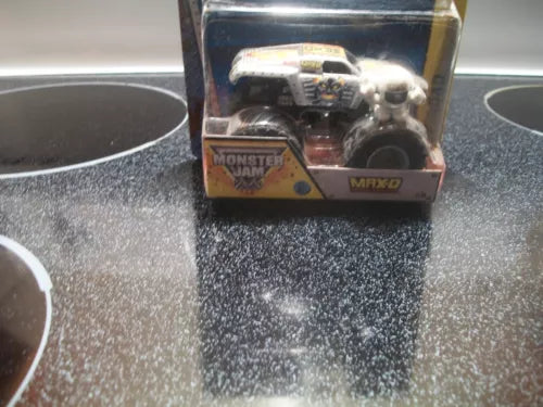 Autographed diecast monster truck in clear display box, visible wheels and chassis