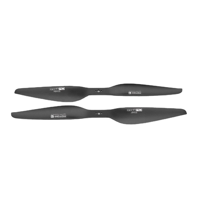 RC carbon fiber drone propeller pair, dark gray with center holes and hub markings
