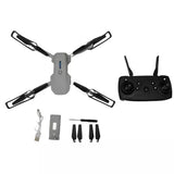 Gray quadcopter drone with controller and included accessories