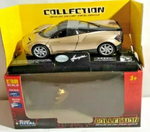 Boxed 1:38 scale diecast car model, gold and black Pagani Huayra