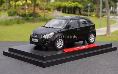 Black diecast car model on display base with front three-quarter view