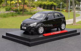 Black diecast car model on display base with front three-quarter view