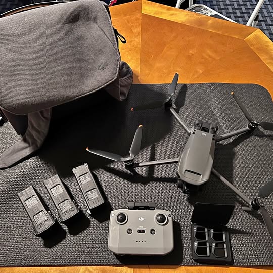 DJI Mavic 3 drone with controller, batteries, and propeller guards in carry case