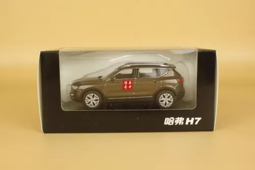 1/43 brown diecast SUV model with red emblem, in display box