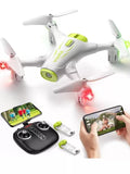White mini quadcopter drone with green accents and FPV camera, remote and phone shown