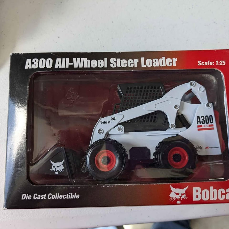 White die-cast A300 all-wheel steer loader in retail box, scale 1:25