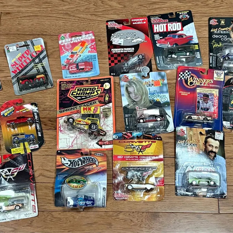 Diecast car assortment in blister packs, Johnny Lightning and Hot Wheels vehicles.