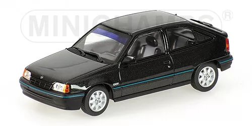 Diecast model car with dark green body and teal stripe, silver wheels, black windows
