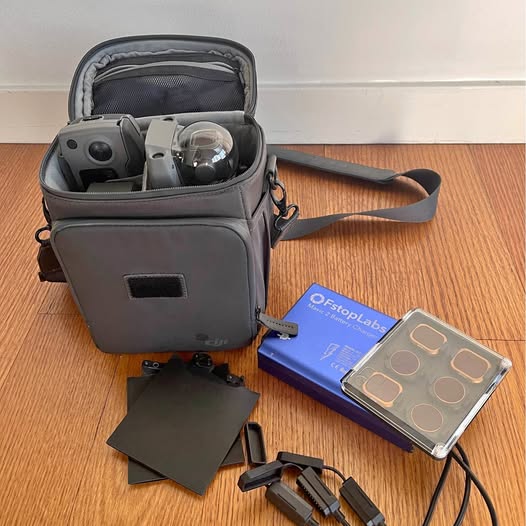 DJI Mavic 2 Pro drone in gray zip case with accessories and spare prop guards