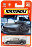 Grey diecast sports car in open blister packaging, Matchbox styling, rear spoiler