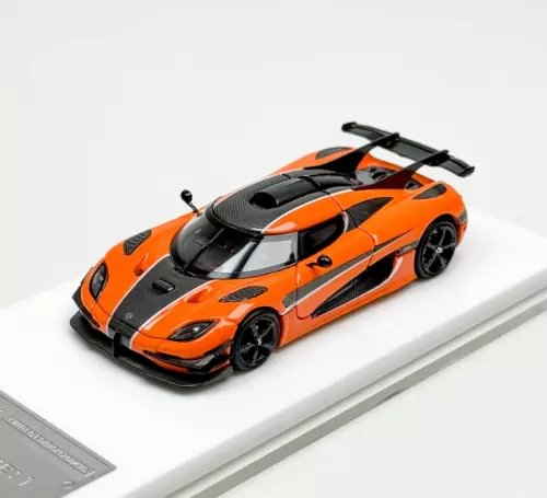 1:64 orange racing diecast model car with black rear wing and decals