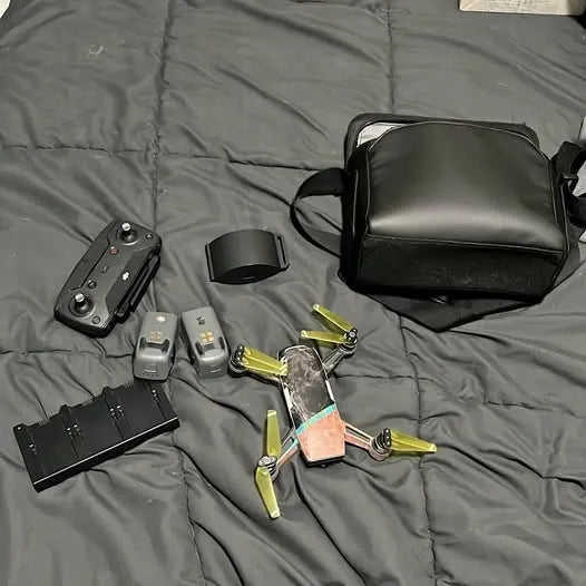 DJI Spark drone accessories: black case, controller, and propellers