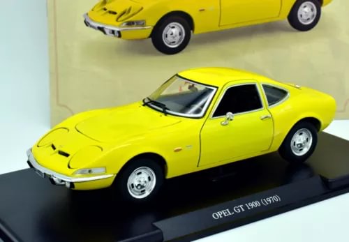 Yellow diecast Opel GT 1900 1:24 scale model coupe with black stripes and chrome wheels