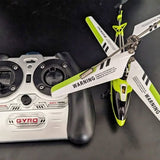 Gyro RC helicopter with white remote controller and lime blades, warning label