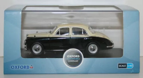 Diecast car model in box, dark body with light roof, Oxford company logo