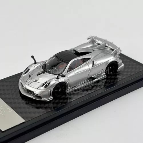 1/64 scale silver diecast sports car model with black wheels and dark windows