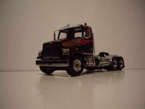 Metallic black diecast semi truck model, daycab cab and front axle detail