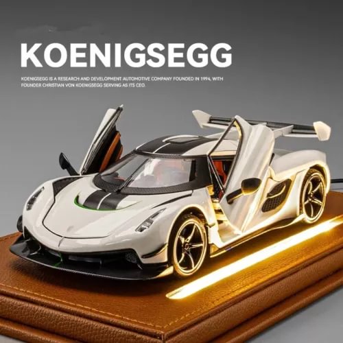 White 1:24 diecast sports racing car model with open doors and gold wheels on display base