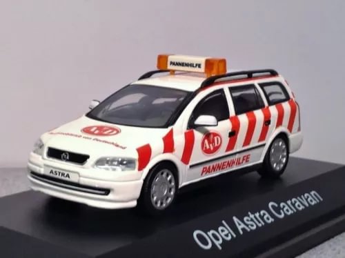 Diecast station wagon model, white with red stripes and roof sign, Opel Astra Caravan.
