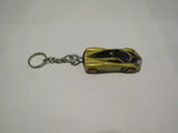 Gold and black race car diecast keychain with metal chain and key ring