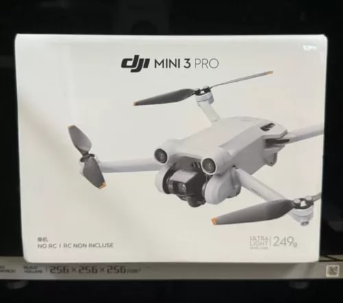 DJI Mini 3 Pro camera drone with four propellers, white body