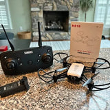 H818 mini drone kit with black controller, propeller drone, and battery pack