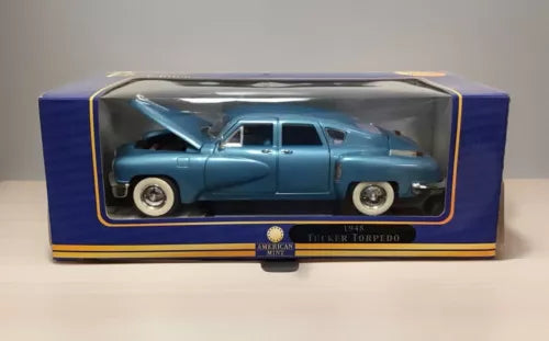 Blue diecast model car in display box, front view with chrome wheels