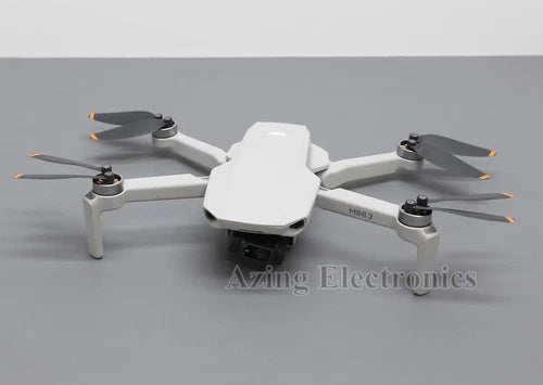 DJI Mini 2 foldable quadcopter drone, white body with four propellers