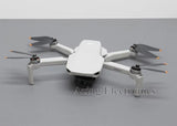 DJI Mini 2 foldable quadcopter drone, white body with four propellers