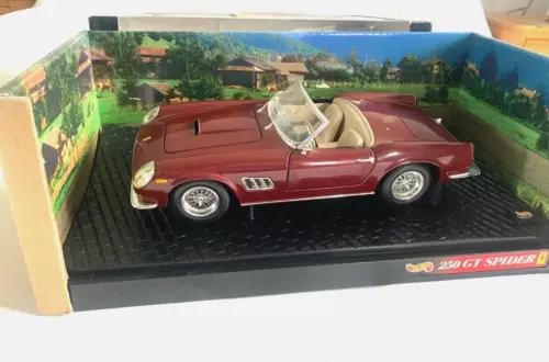 Maroon diecast sports car with open top, in clear display box