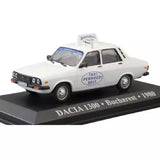 White Dacia 1300 taxi diecast model car, front grille and side taxi signage visible