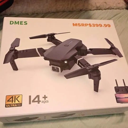 Dark gray foldable quadcopter drone with four propellers