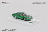 Green 1:64 Lincoln Town Car diecast toy car model on display base