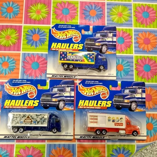 Hot Wheels Haulers diecast truck set in retail boxes, blue and multicolor graphics