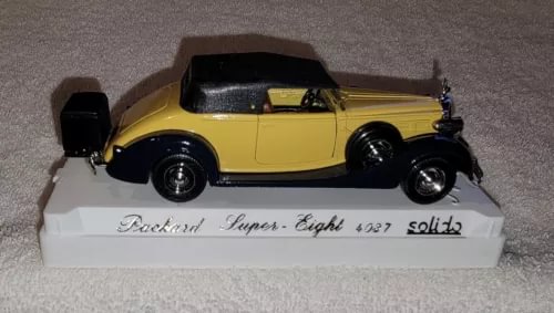 Yellow and black diecast model car, Packard Super Eight 4037, 1:43 on white base